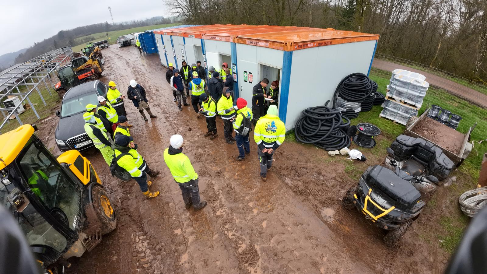 COH site team briefing at the construction base camp